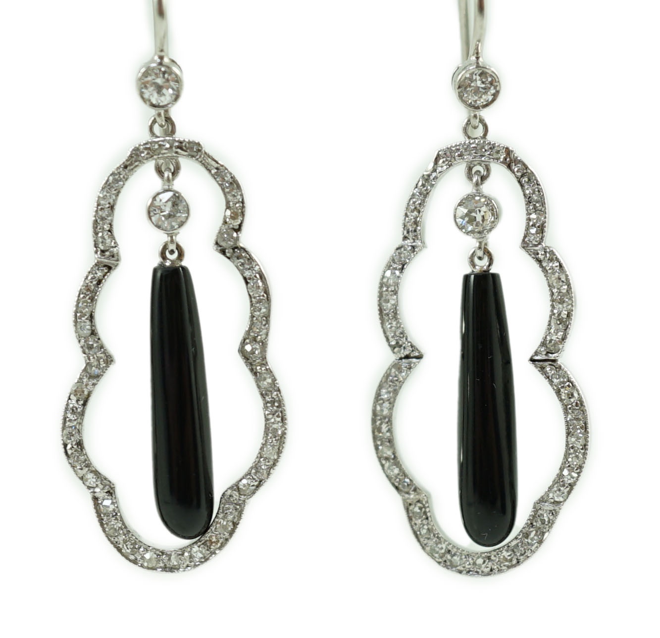 A pair of 20th century white gold, black onyx and diamond cluster set drop earrings